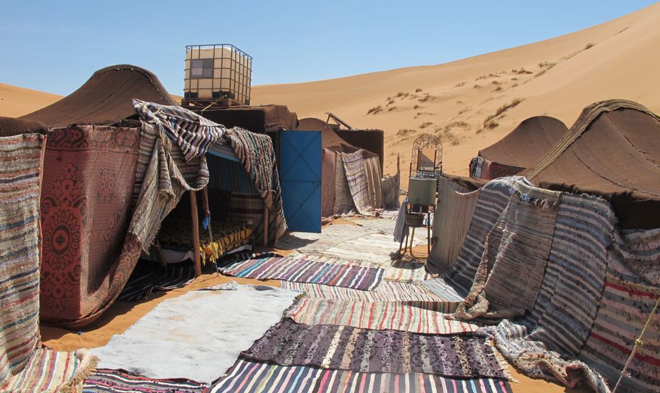 Spend a night or two at a real desert camp in the giant dunes of Merzouga near E